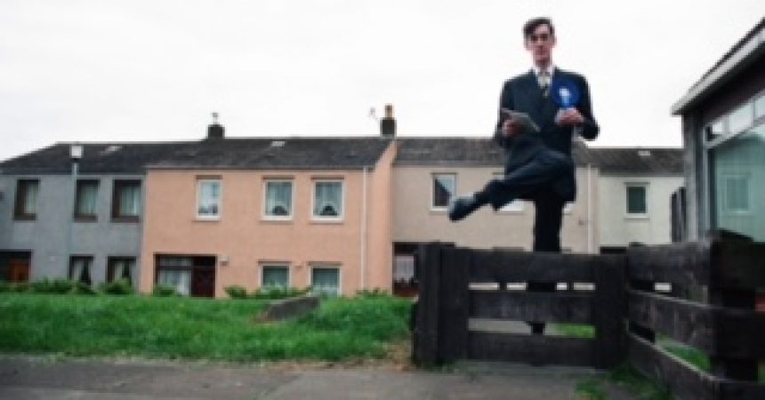 Conservative (Tory) candidate Jacob Rees-Mogg canvasses support in a housing estate in Groban, Leven, part of the Labour-held constituency of Central Fife during the 1997 UK General Election campaign. The son of acclaimed journalist and writer William Rees-Mogg, at the age of 28, this was his first attempt to win a seat at Westminster however he was soundly beaten by the eventual winner Henry McLeish MP. Jacob Rees-Mogg was elected as Member of Parliament for North East Somerset in 2010.